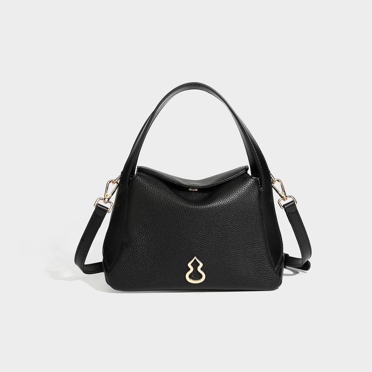 Structured pebbled leather-look shoulder bag with flap top, gold-tone emblem hardware, dual top handles, and detachable