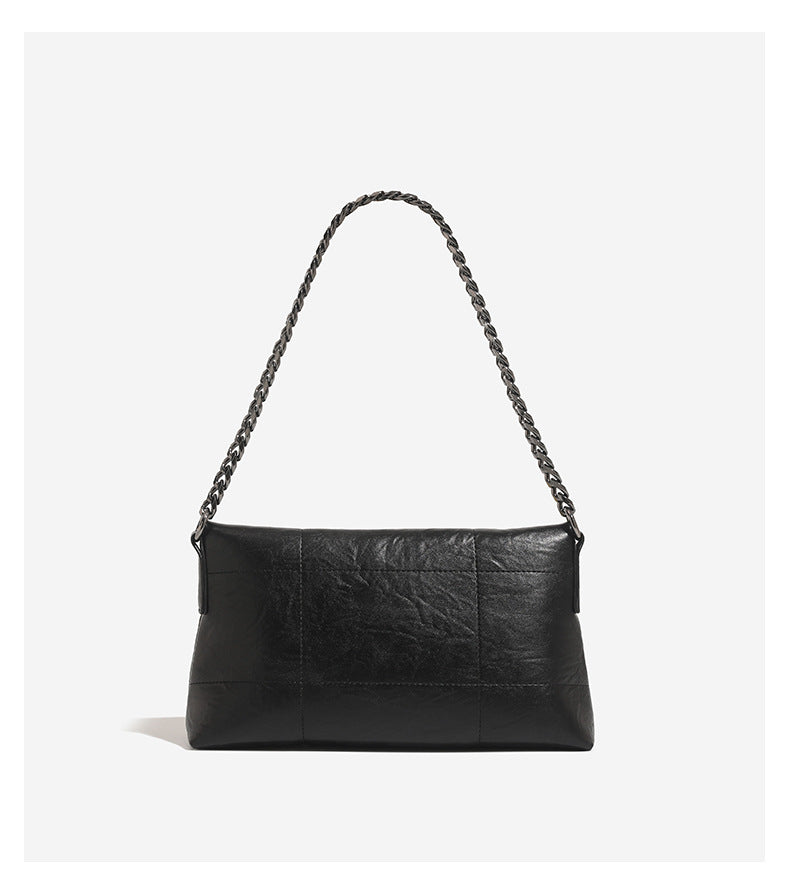 Soft rectangular leather-look convertible shoulder bag with dark curb-chain strap and rounded rectangular metal handle