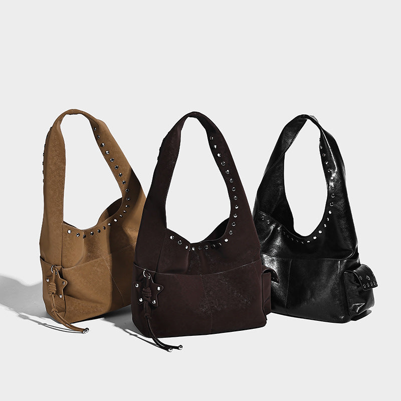 Slouchy hobo shoulder bag in dark brown matte suede-look finish with silver-tone stud-trimmed strap and drawstring side