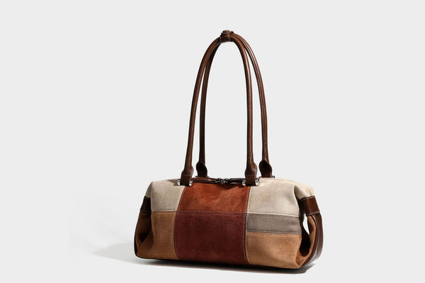 Patchwork suede-look barrel shoulder bag in brown, rust, tan, beige, and gray panels with double leather-look straps and