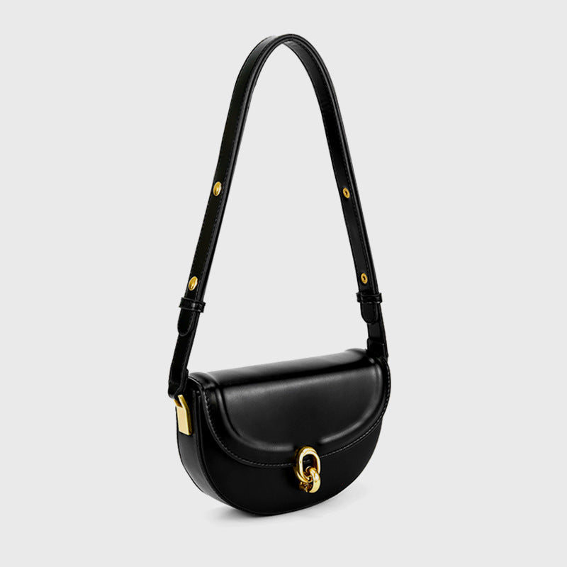 Mini black leather-look saddle bag with gold-tone carabiner clasp and adjustable shoulder strap, front view