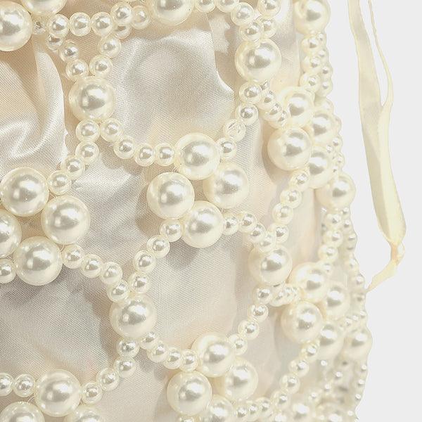 Small pearl-beaded lattice drawstring bucket bag with beaded shoulder strap and ribbon closure, detail view 21