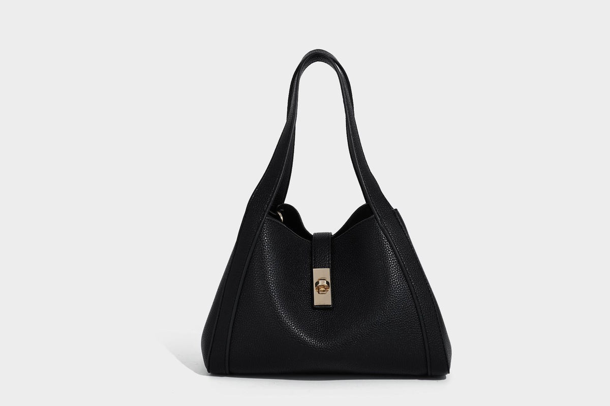 Structured trapezoid tote bag in taupe pebbled leather-look finish with gold-tone turn-lock hardware, dual top handles, and