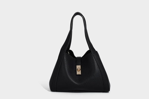 Structured trapezoid tote bag in taupe pebbled leather-look finish with gold-tone turn-lock hardware, dual top handles, and