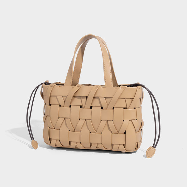Structured woven basket tote handbag with contrasting dark trim, double top handles, detachable shoulder strap, and
