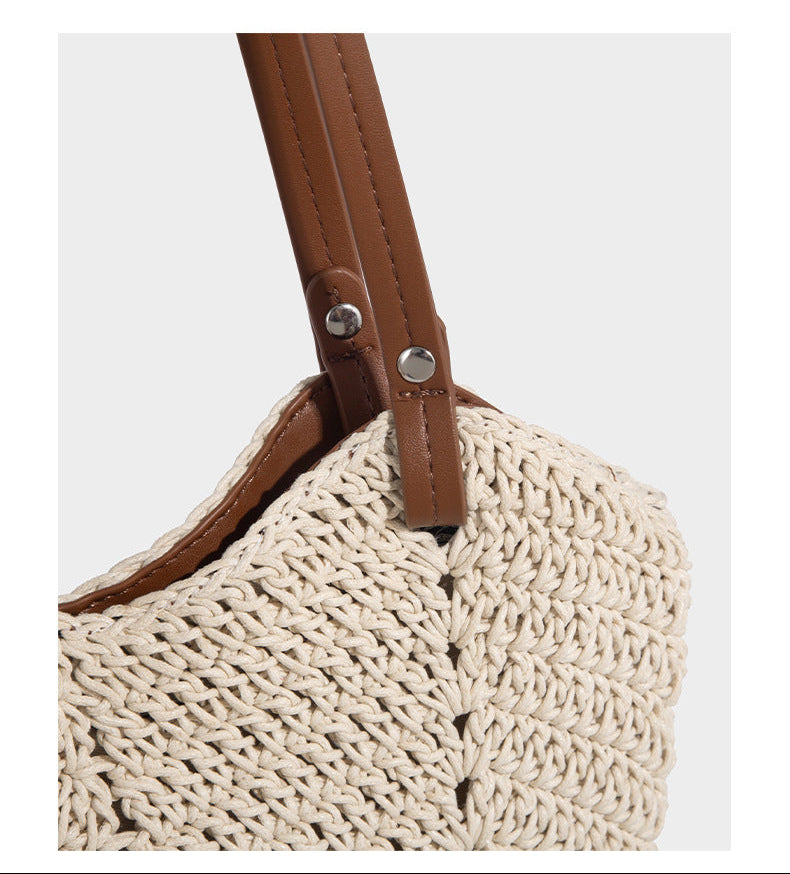 Woven crochet open-top shoulder tote bag with slim brown leather-look straps and braided charm accent, detail view 14