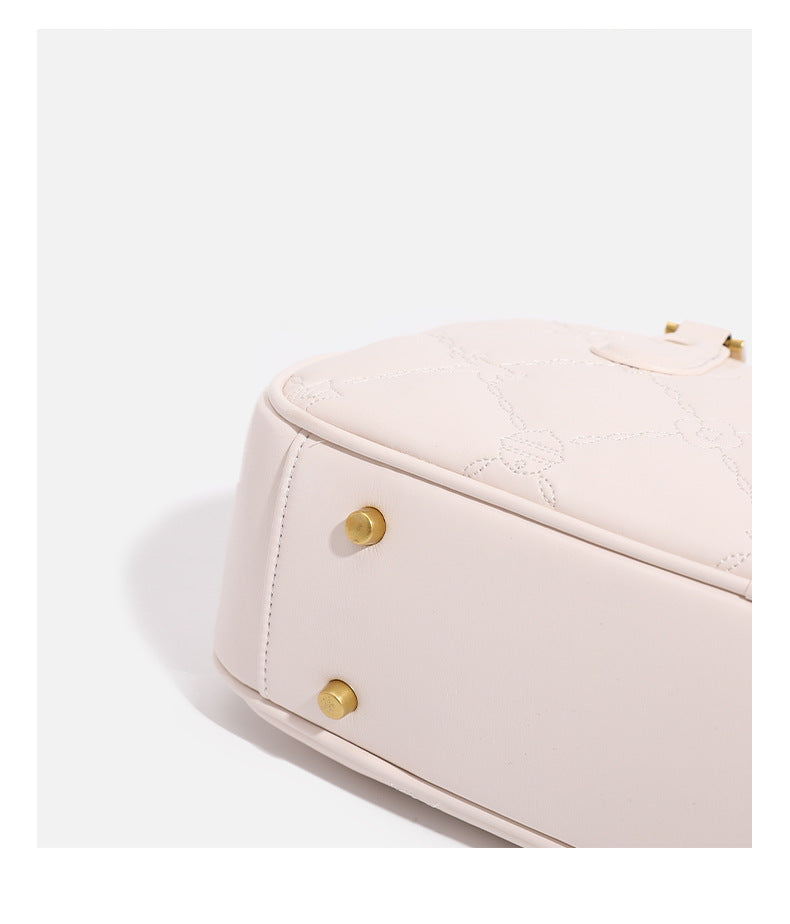 Small structured quilted leather-look zip shoulder bag with gold-tone hardware and adjustable strap, detail view 22