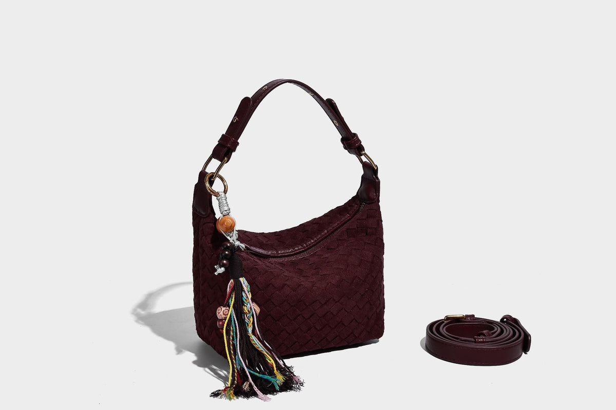 Small woven-texture crescent hobo bag in dark chocolate brown with top zip closure, gold-tone hardware, and adjustable