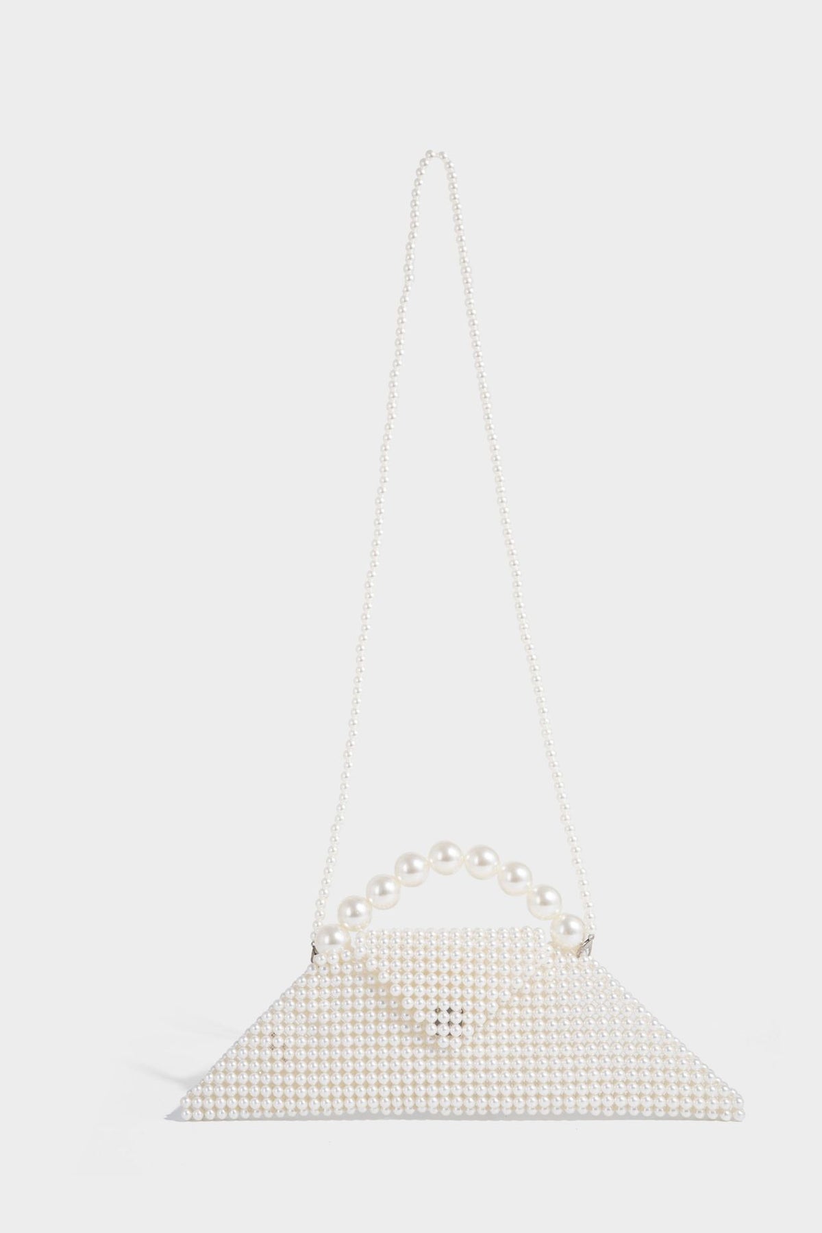 Small structured triangle clutch bag covered in glossy pearl beads with an arched pearl top handle and silver snap closure