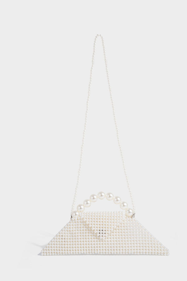 Small structured triangle clutch bag covered in glossy pearl beads with an arched pearl top handle and silver snap closure