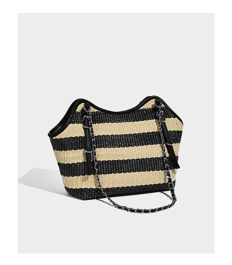 Black and natural striped woven tote bag with chain shoulder strap and silver-tone turn-lock hardware, detail view 9
