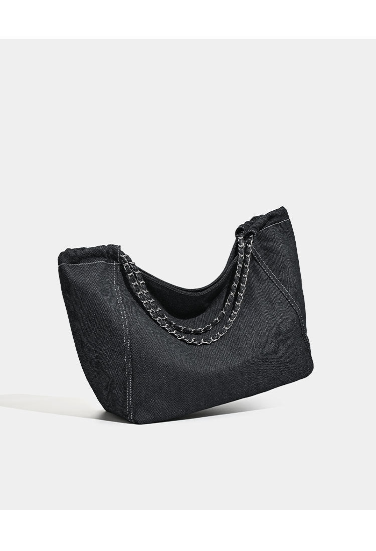 Large slouchy denim tote bag with silver-tone chain strap and contrast topstitching, detail view 11