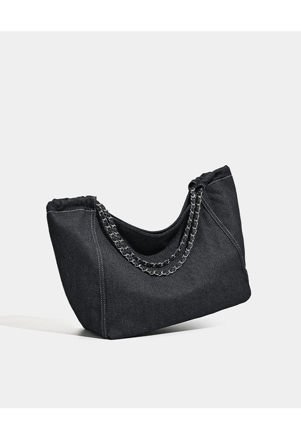 Large slouchy denim tote bag with silver-tone chain strap and contrast topstitching, detail view 11