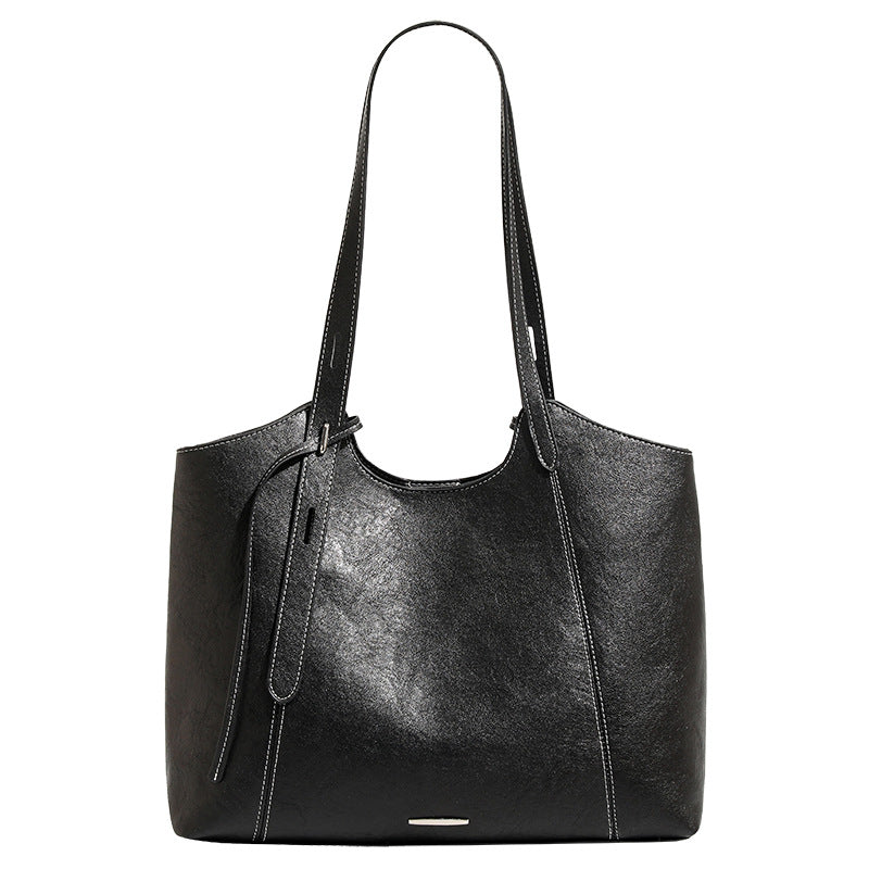 Structured open-top leather-look tote bag with long shoulder straps, contrast stitching, and side tie details, detail view 5