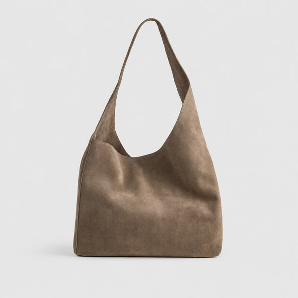 Large slouchy hobo shoulder bag in brushed suede-like finish with single flat strap and unstructured body, detail view 7
