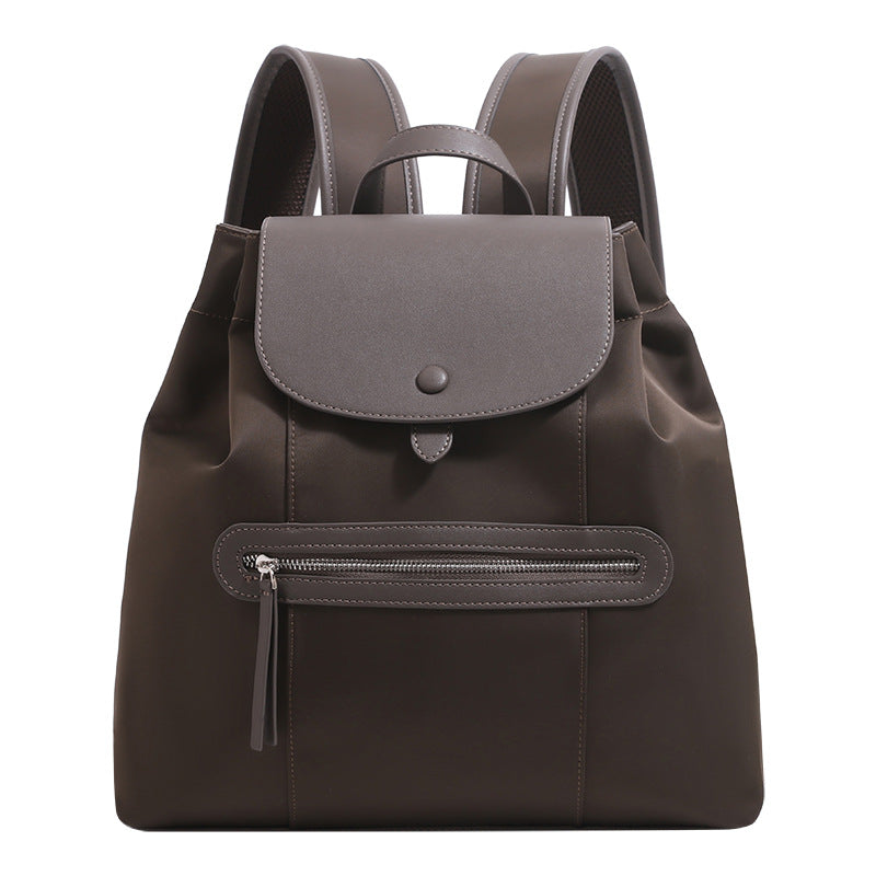 Structured flap backpack handbag with snap closure and front zip pocket, detail view 5