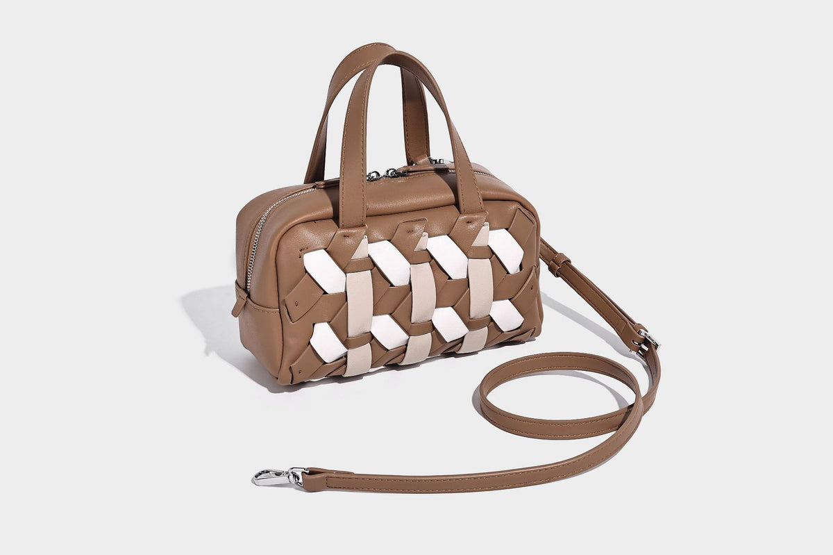 Small structured satchel bag with two-tone woven front panel, dual top handles, and detachable crossbody strap in tan brown