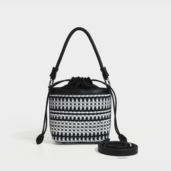 Small structured woven checker bucket bag with braided top handle, drawstring closure, and silver-tone hardware in black