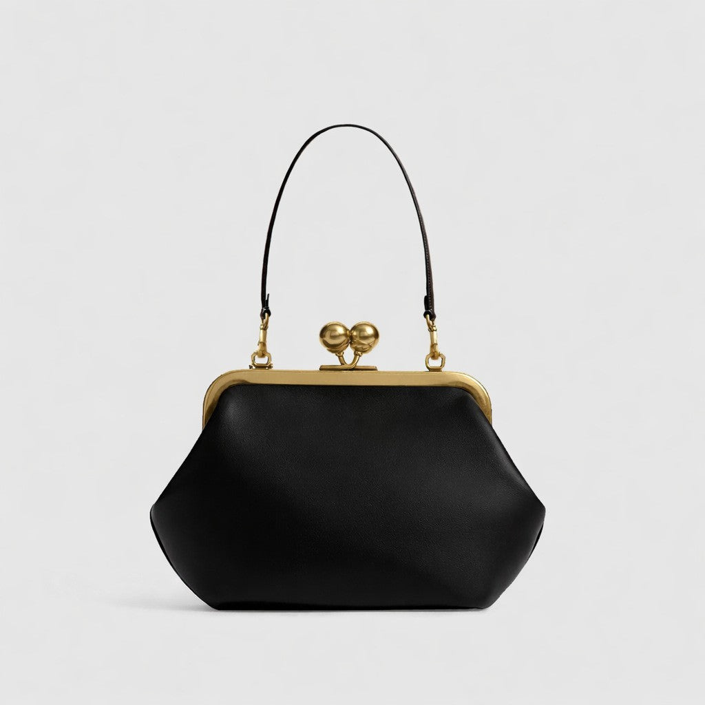 Oversized kiss-lock frame handbag with gold-tone metal clasp and smooth leather-look finish, detail view 12
