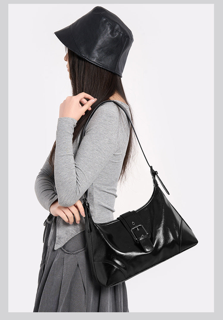 Glossy dark brown slouch hobo shoulder bag with front buckle strap panel and long adjustable single strap, detail view 23