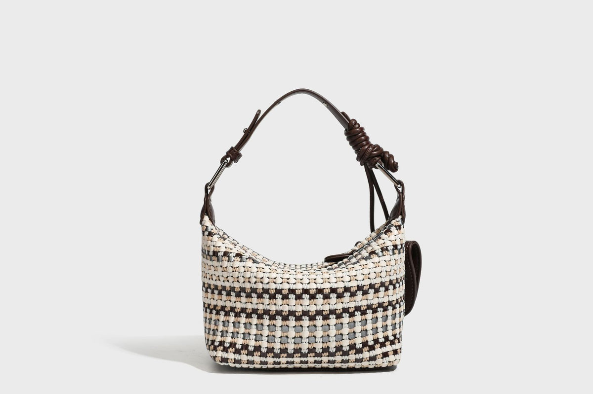 Small crescent shoulder bag in black-and-white woven textile with smooth black leather-look trim, zip-top closure, knotted