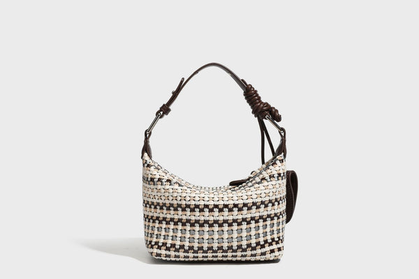 Small crescent shoulder bag in black-and-white woven textile with smooth black leather-look trim, zip-top closure, knotted