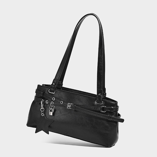 Structured glossy leather-look shoulder bag with wraparound belt straps, silver-tone hardware, and dangling star charm