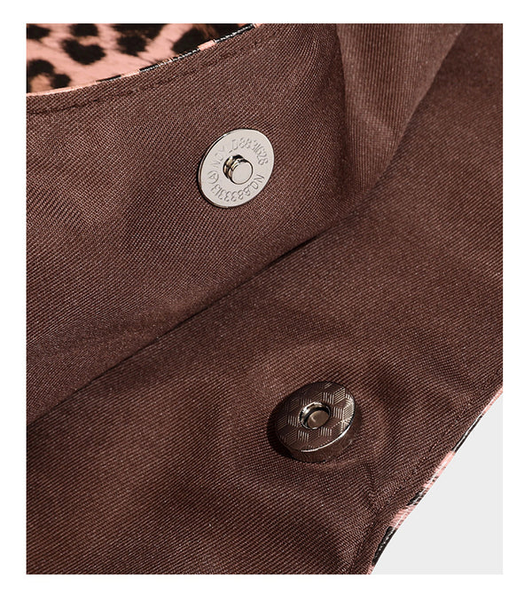 Large leopard print shoulder tote bag with glossy finish, long double straps, front zip pocket, silver-tone hardware, and