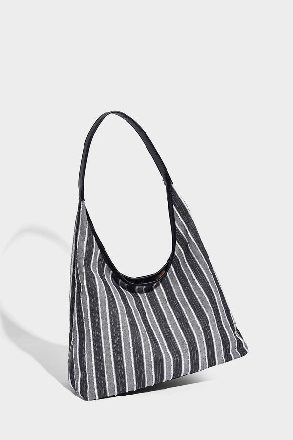 Slouchy striped canvas hobo shoulder bag with cream trim and long knotted strap, detail view 7