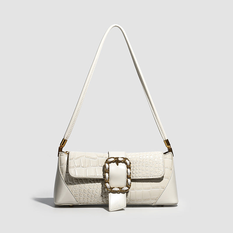 Crocodile-embossed leather-look baguette shoulder bag with gold-tone chain buckle closure and single shoulder strap, detail