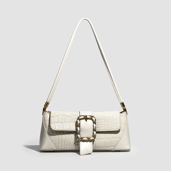 Crocodile-embossed leather-look baguette shoulder bag with gold-tone chain buckle closure and single shoulder strap, detail