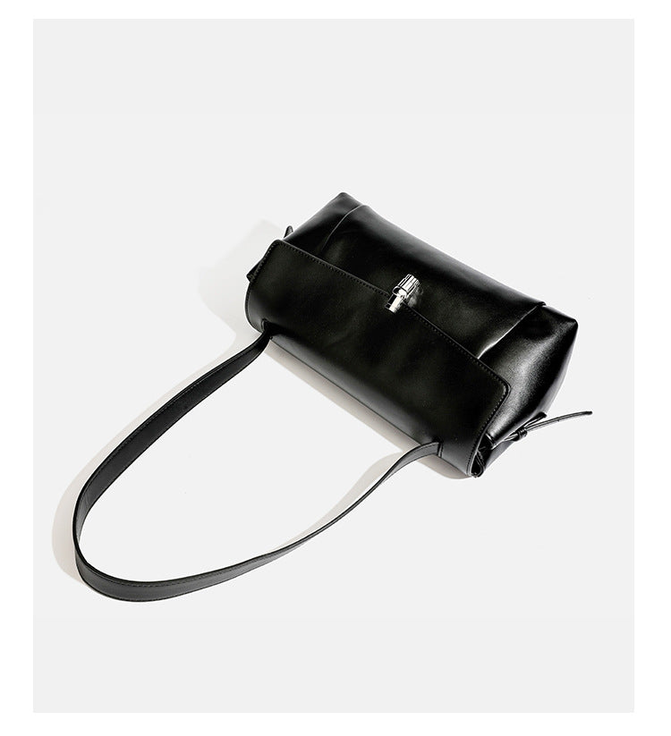 Structured rectangular flap shoulder bag with smooth leather-look finish, silver-tone turn-lock clasp, and long slim