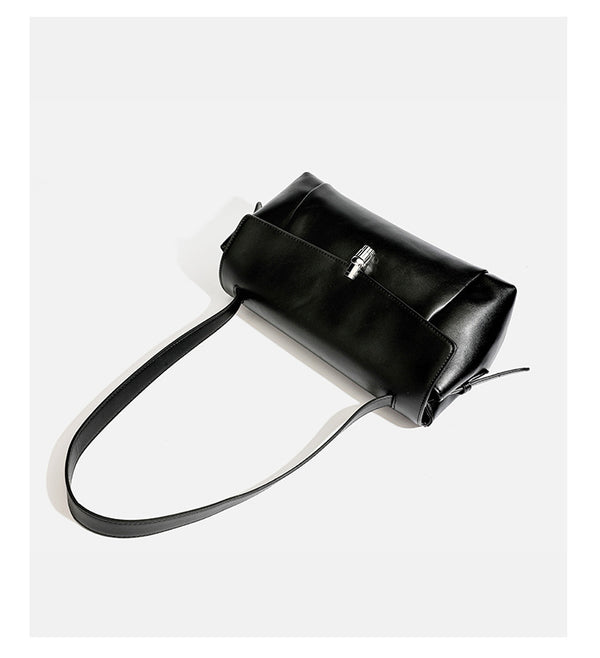 Structured rectangular flap shoulder bag with smooth leather-look finish, silver-tone turn-lock clasp, and long slim