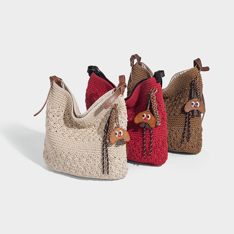 Slouchy woven crochet shoulder bag with cognac leather-look adjustable strap and snap-top closure, detail view 2