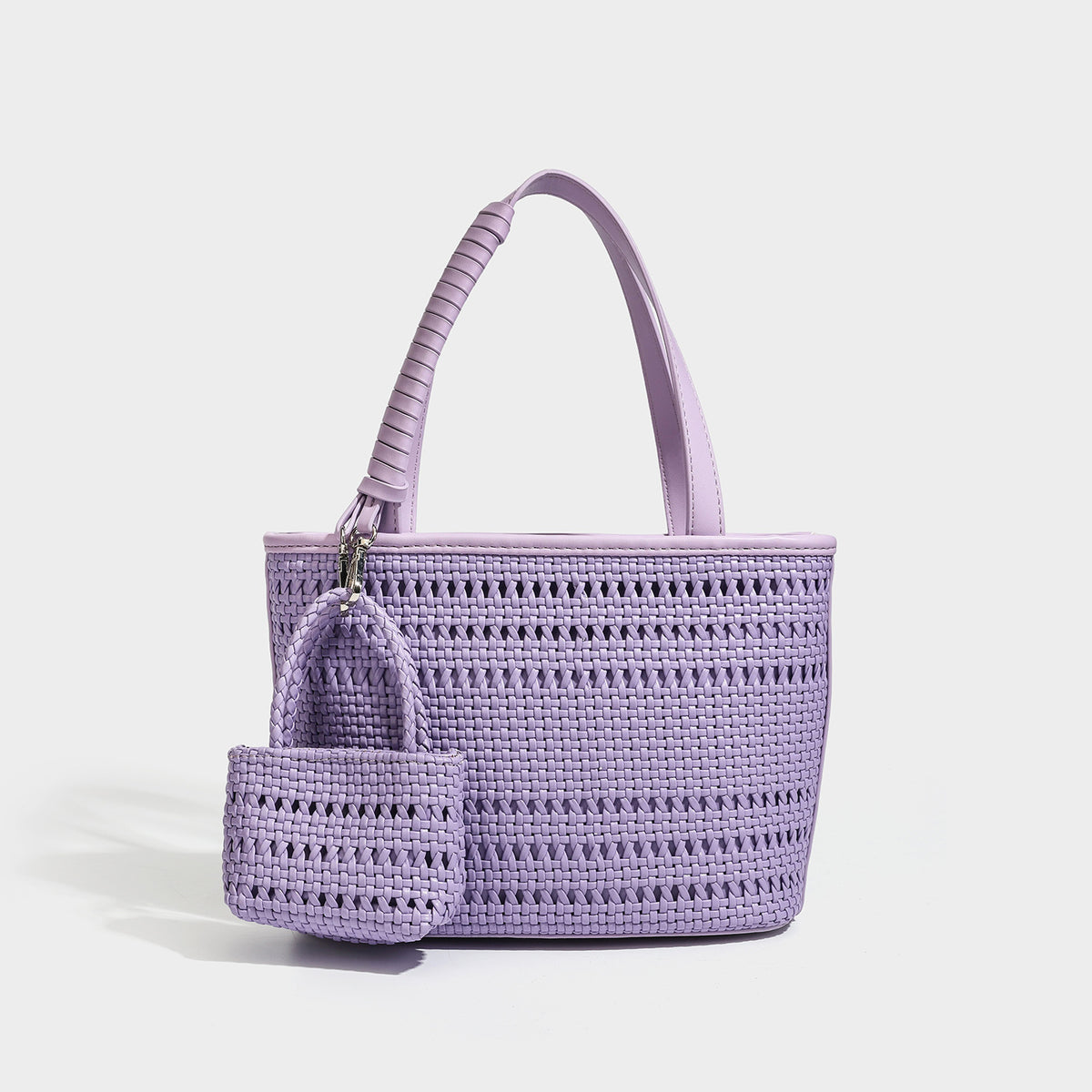 Structured open-weave tote bag with smooth leather-look trim, double top handles, detachable crossbody strap, and mini zip