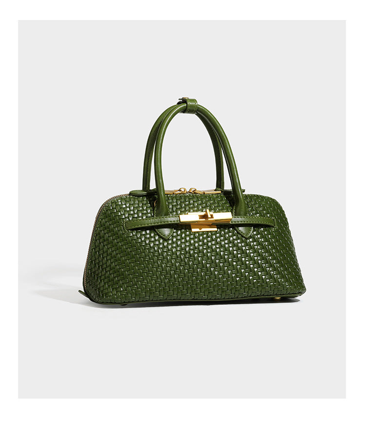Structured woven-embossed leather-look satchel with dual rolled top handles, gold-tone turn-lock closure, and detachable