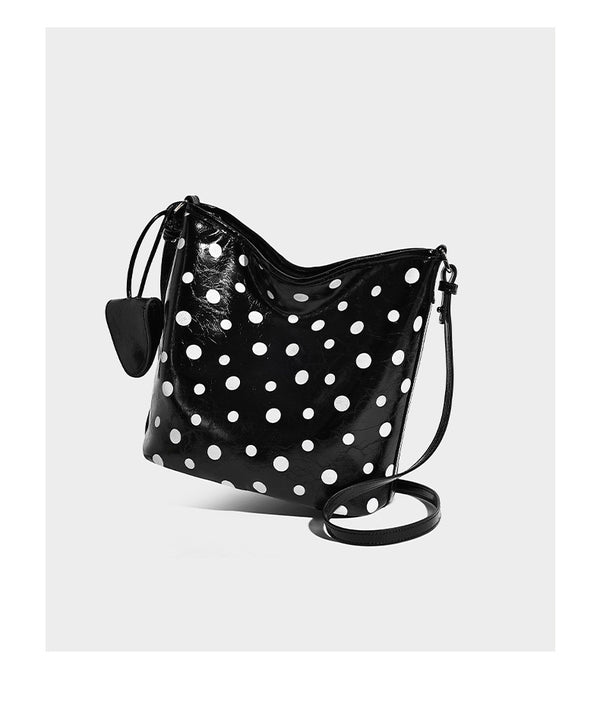 Glossy crinkled polka-dot bucket hobo bag with adjustable crossbody strap and side pouch, detail view 10