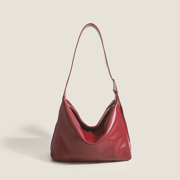 Large slouchy hobo shoulder bag in smooth leather-look finish with single long strap and gold-tone zip closure, detail view 6