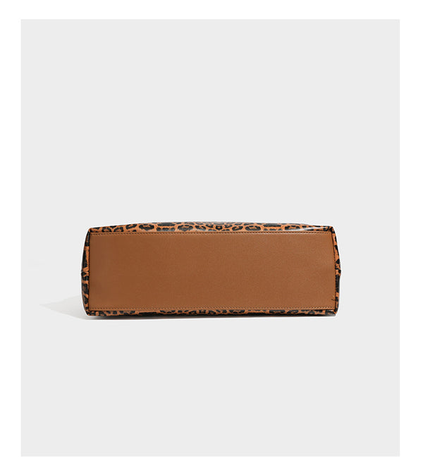 Glossy leopard-print slouchy shoulder bag with long strap and detachable tan zip pouch, detail view 14