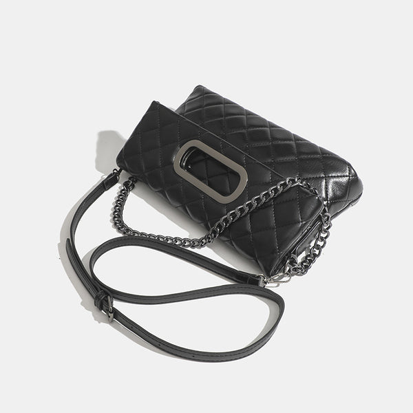 Quilted diamond-stitch flap crossbody bag with gunmetal chain strap and cut-out bar handle, detail view 3