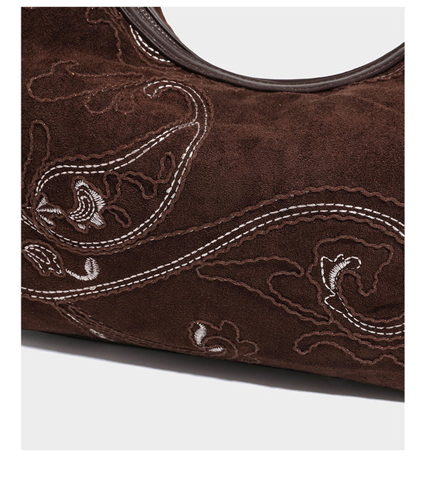 Deep chocolate suede-look hobo shoulder bag with tonal paisley floral embroidery, smooth dark leather-look trim, top zip