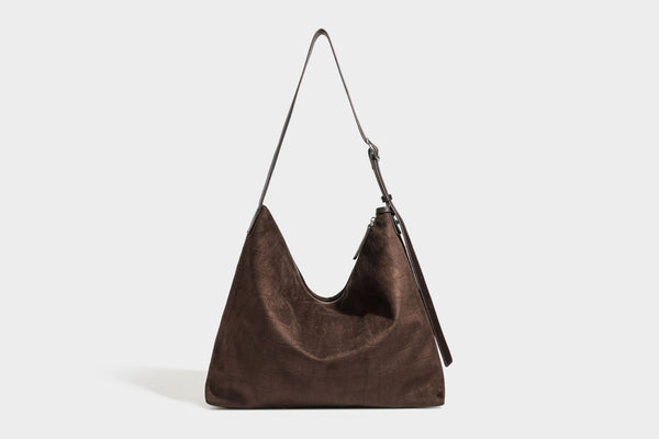 Slouchy hobo shoulder bag in matte croc-embossed leather-look finish with top zip closure and long adjustable strap, detail