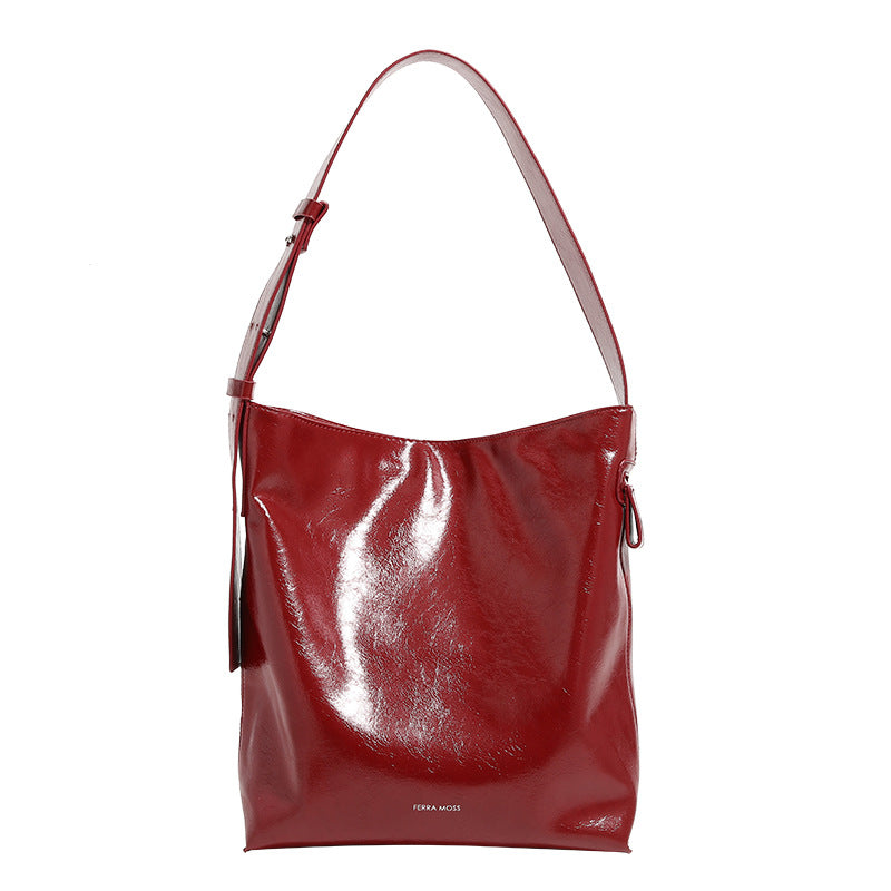 Glossy leather-look oversized shoulder tote bag with wide flat strap and soft rectangular silhouette, detail view 5