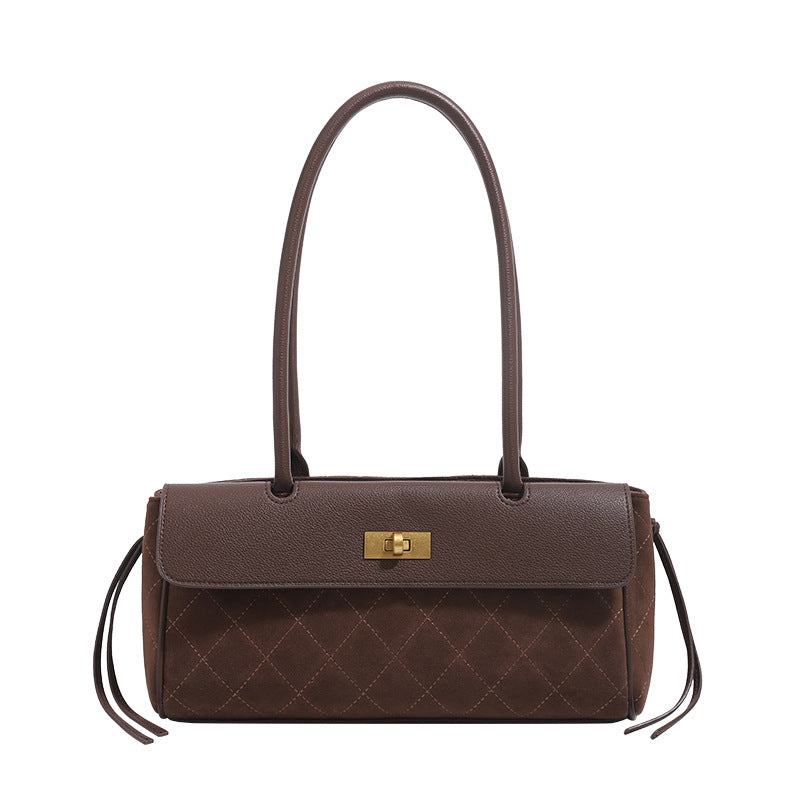 Structured diamond-quilted baguette shoulder bag with gold-tone turn-lock closure and side drawstring ties, detail view 5