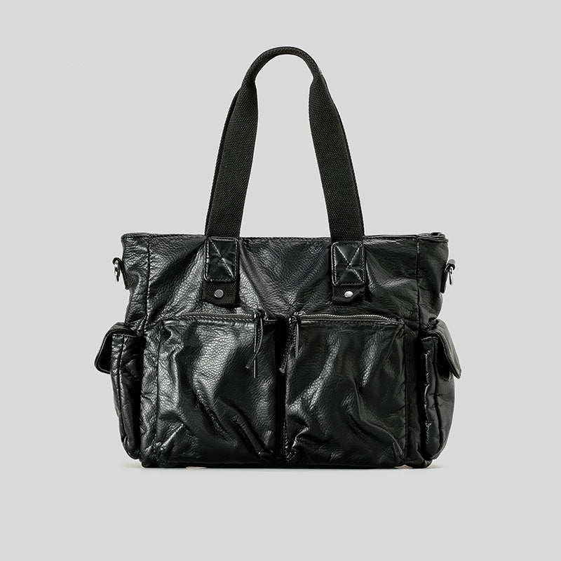 Slouchy crinkled pebbled leather-look convertible tote bag in gunmetal black with woven top handles, adjustable shoulder