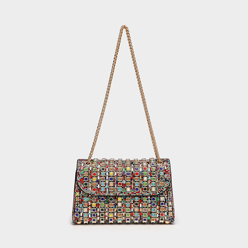 Structured mini flap crossbody bag covered in grid-set rhinestones with silver-tone chain strap, detail view 3
