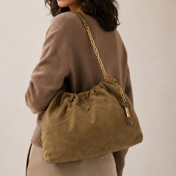 Slouchy suede-look shoulder bag with gathered top, angular stitched paneling, and chunky gold-tone chain strap, detail view 4
