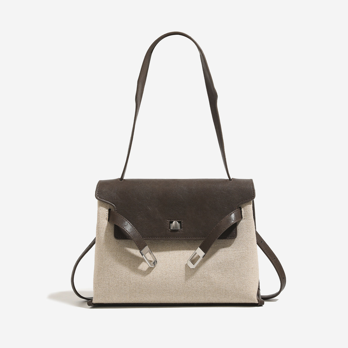 Structured trapezoidal flap satchel bag with silver-tone turn-lock clasp, decorative front strap tabs, gusseted sides, and