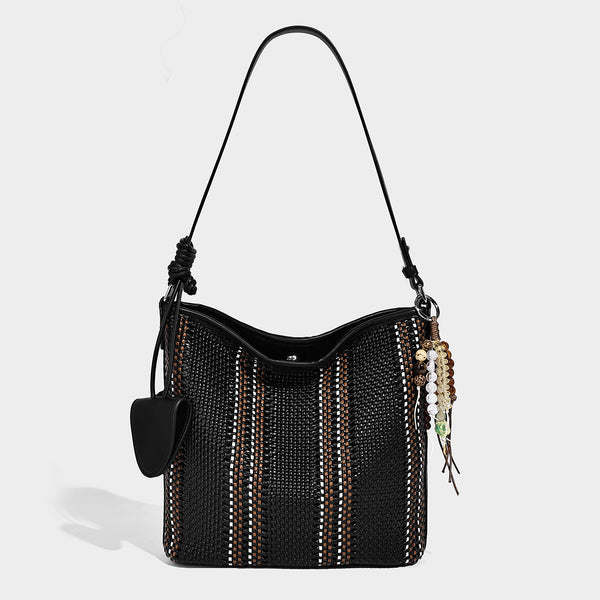 Woven bucket shoulder bag with leather-look trim, silver-tone hardware, and beaded tassel charm, detail view 11
