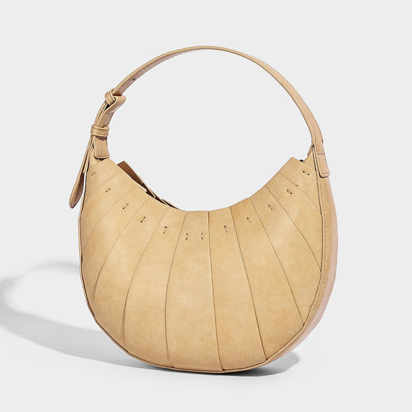 Crescent half-moon shoulder bag with vertical panel seaming, matte-satin leather-look finish, and adjustable gold-tone